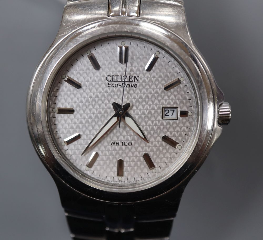 A gentlemans modern stainless steel Citizen Eco-Drive wrist watch, with baton numerals and date aperture